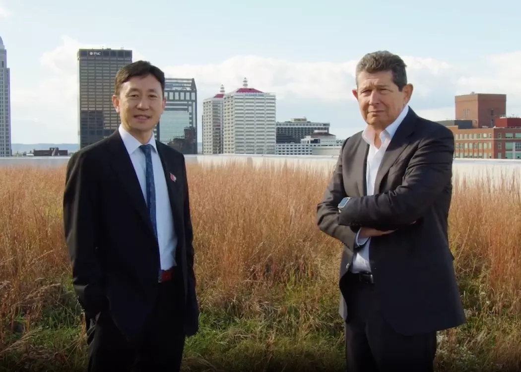 Jiapeng Huang and Jon Klein in front of the Louisville skyline