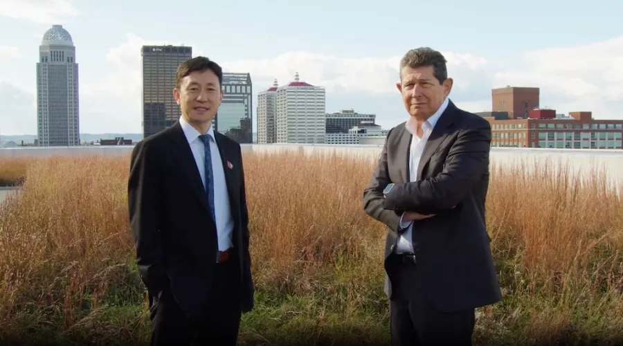 Jiapeng Huang and Jon Klein in front of the Louisville skyline