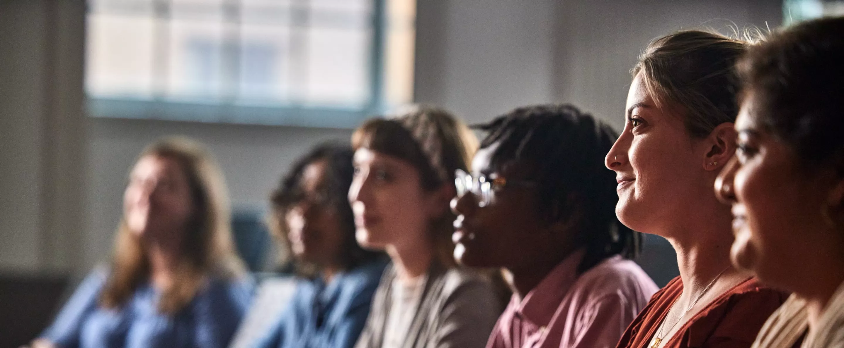 Multiple law students listen to a lecture