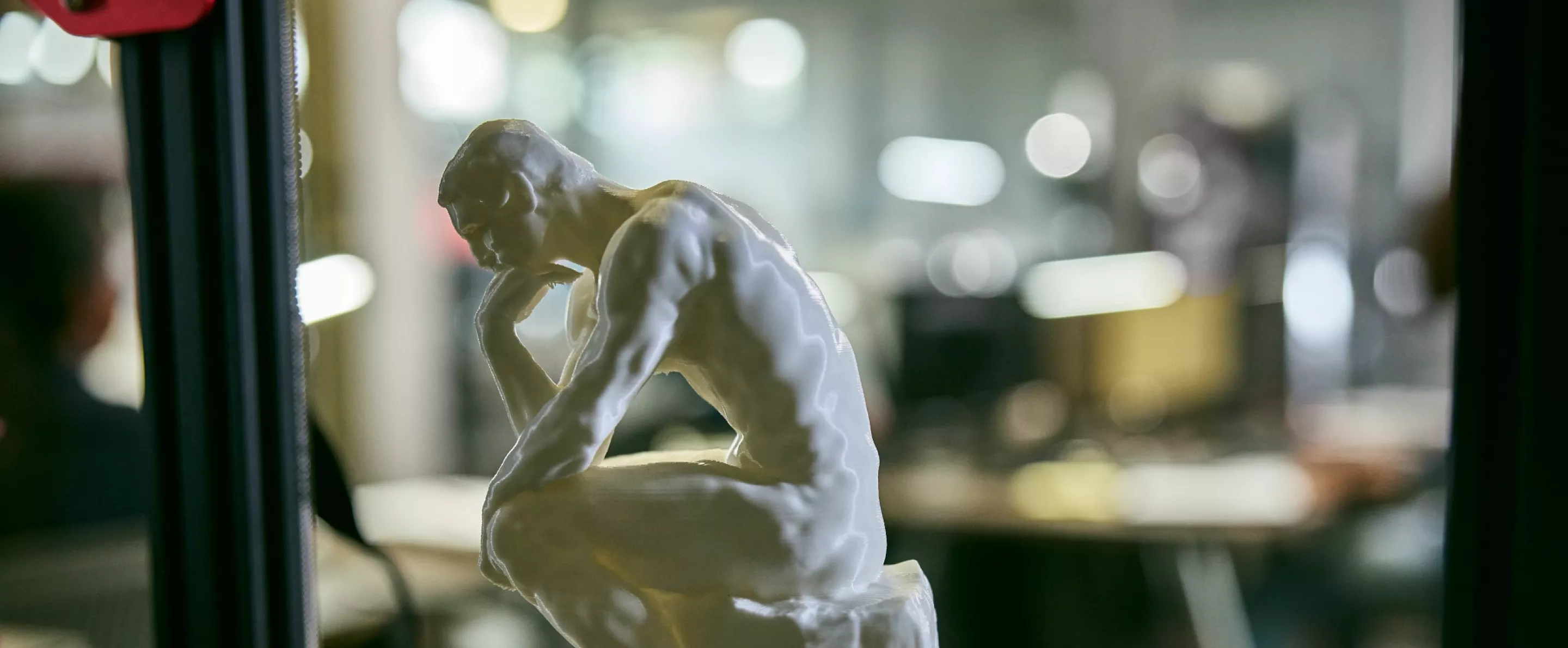 A miniature sculpture of the Thinker in the AMIST facility.