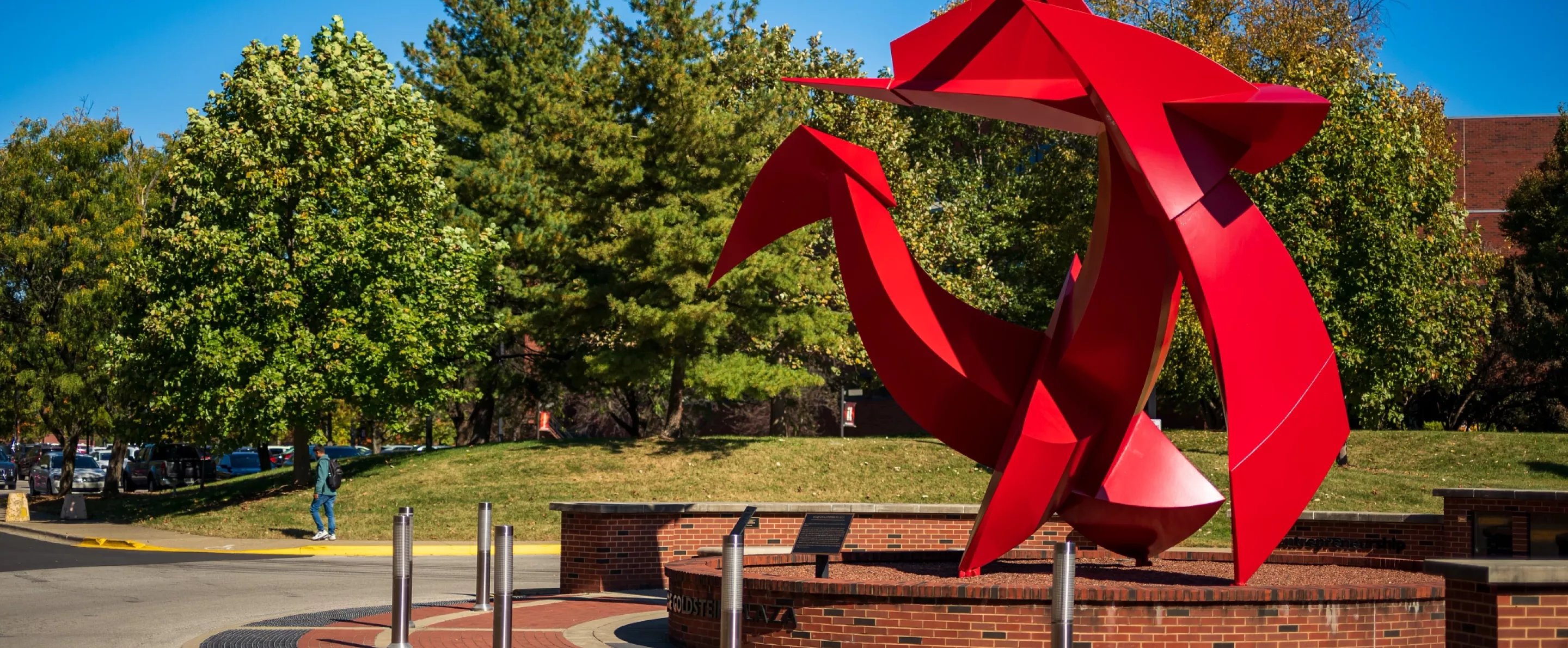 Wide-angle of the Big Red sculpture outside of the College of Business