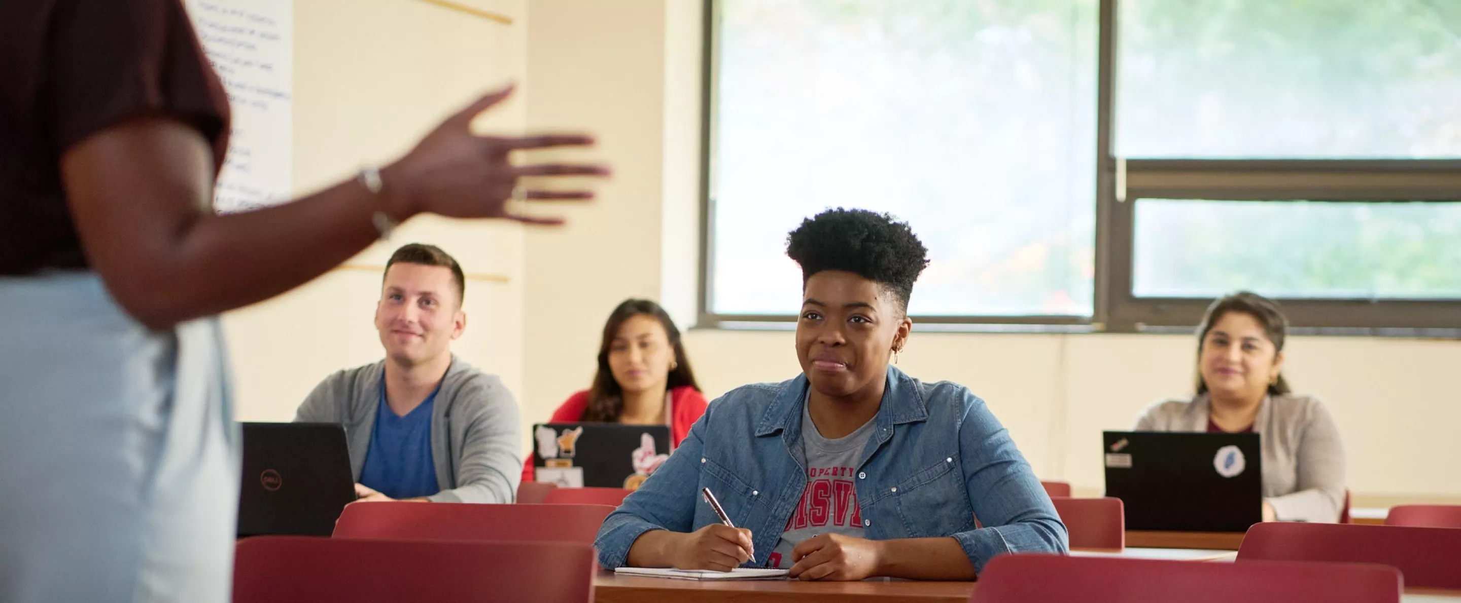 Female professor teaches her class.