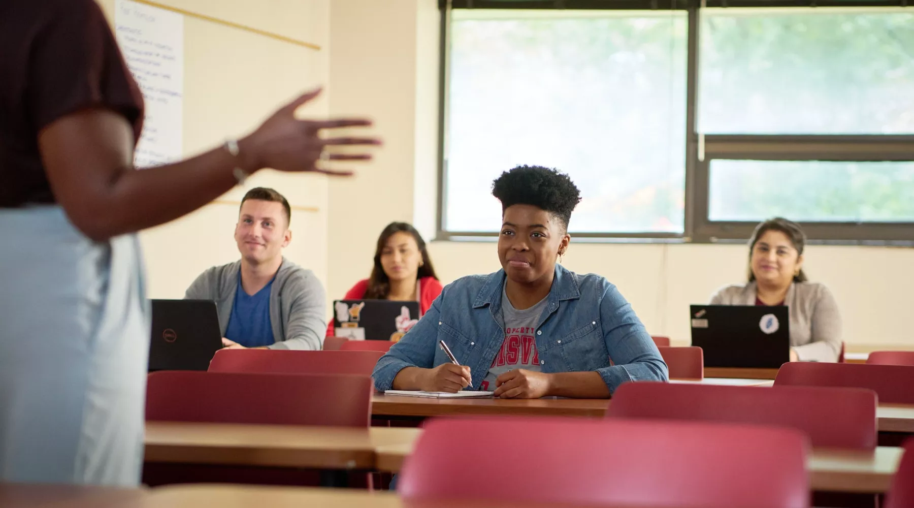 Female professor teaches her class.