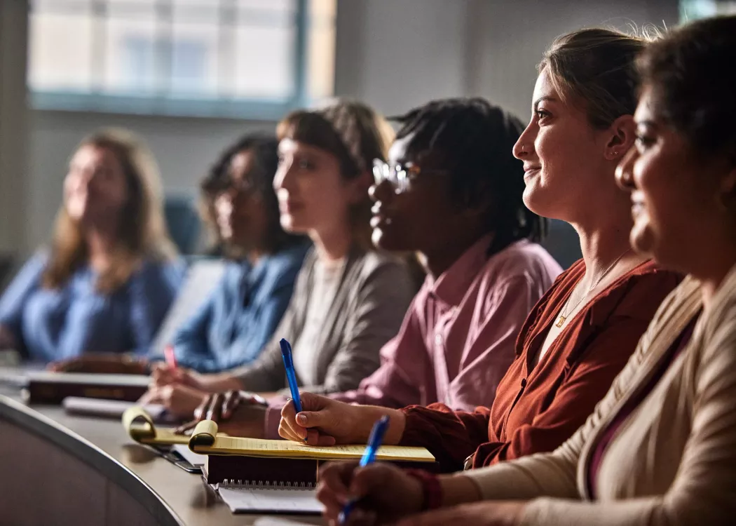 Multiple law students listen to a lecture