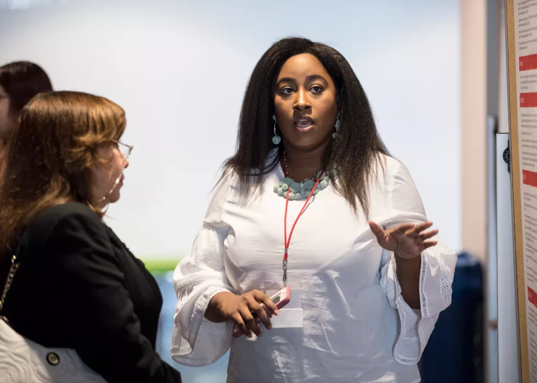 Graduate research students in a discussion