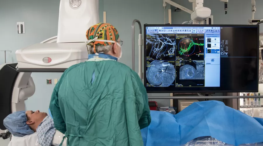 Doctor and patient look at radiology work