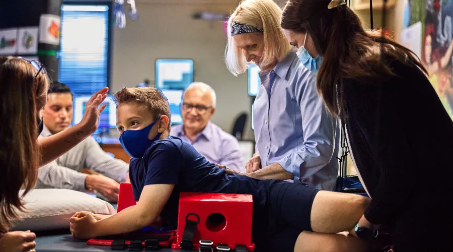 Andrea Behrman is doing research on and analyzing a child's spinal cord.